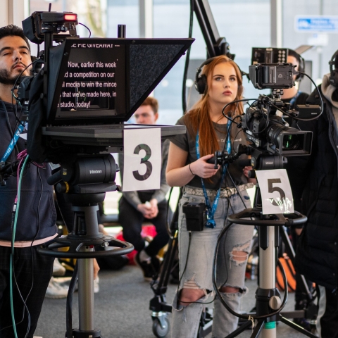 Student film crew producing a show