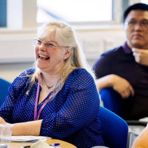 A member of staff laughing