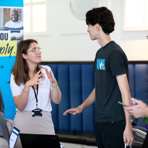 Parents and students talking with staff at the information fair - Open Day 2023