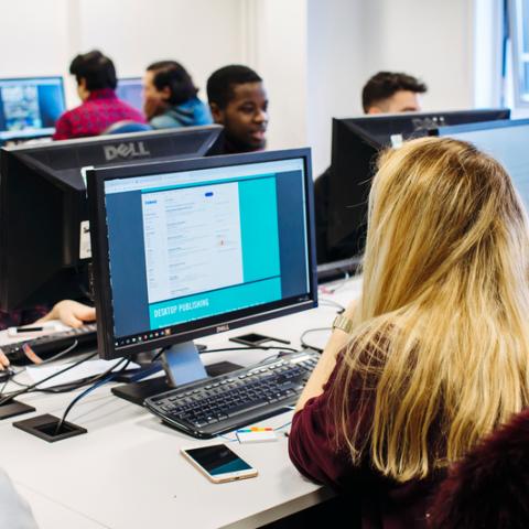 A group of students on computers in a room