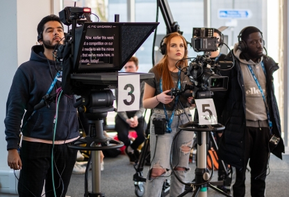 Student film crew producing a show