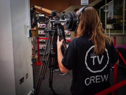 University of Portsmouth student operates a camera mounted on a crane