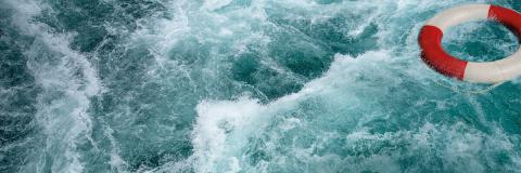 Choppy waters with floating life ring buoy