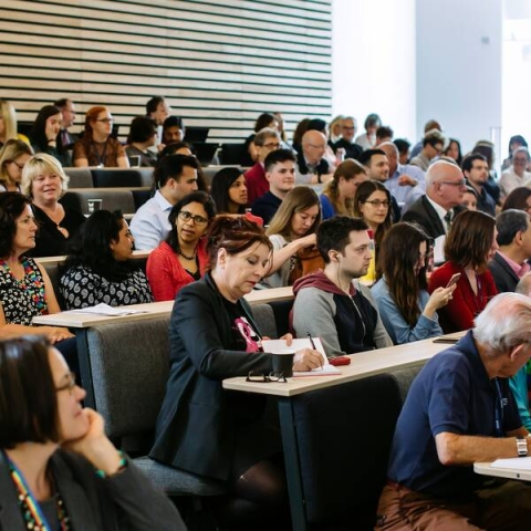 Students and staff in a lecture hall