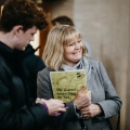 Parent and young person attending an event smiling