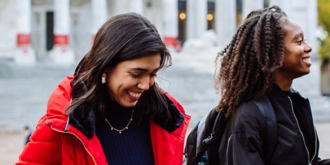 two students at guildhall smiling