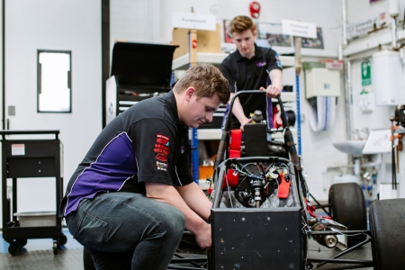 Students working on a race car