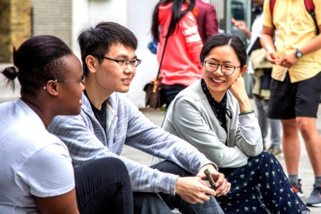 marketing students talking in a crowd